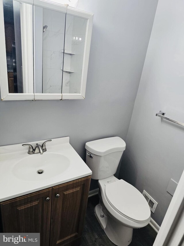 9090 Moonshine Holw Unit C, Laurel, MD 20723 - bathroom featuring vanity and wood finished floors