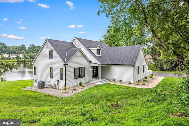 9 W Shore Ct, Landenberg, PA 19350 - rear view of property featuring a water view, a lawn, and roof with shingles