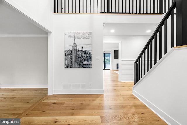 9 W Shore Ct, Landenberg, PA 19350 - entryway featuring ornamental molding, stairway, wood finished floors, and a towering ceiling