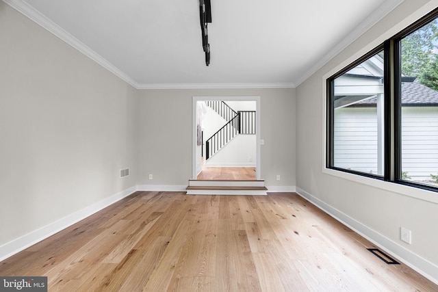 9 W Shore Ct, Landenberg, PA 19350 - unfurnished room with light wood-style floors, crown molding, and stairway