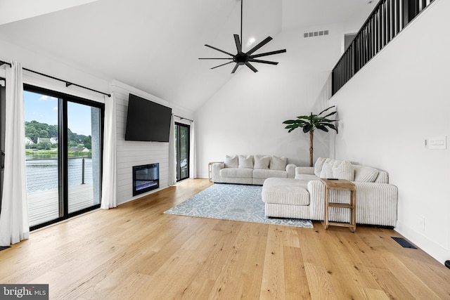 9 W Shore Ct, Landenberg, PA 19350 - living area featuring light wood-style floors, a ceiling fan, high vaulted ceiling, and a fireplace