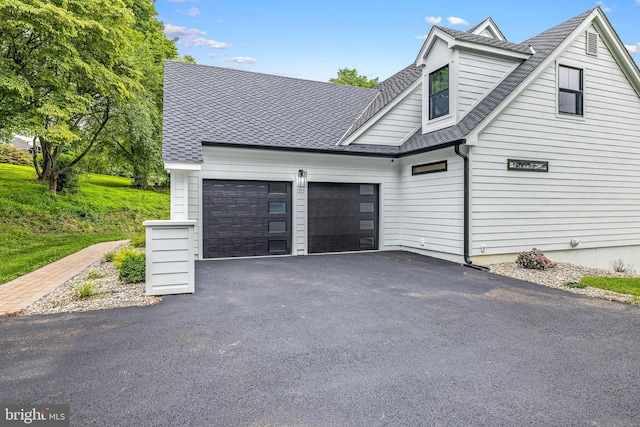 9 W Shore Ct, Landenberg, PA 19350 - view of front of house with an attached garage, driveway, and a shingled roof