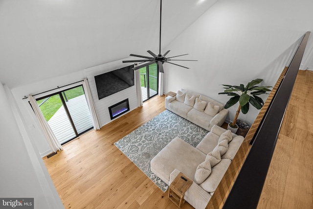 9 W Shore Ct, Landenberg, PA 19350 - living room with healthy amount of natural light, high vaulted ceiling, wood finished floors, a large fireplace, and ceiling fan
