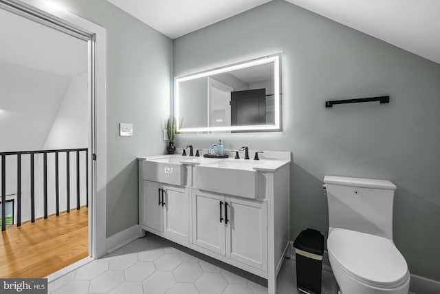9 W Shore Ct, Landenberg, PA 19350 - bathroom featuring double vanity, lofted ceiling, and tile patterned floors