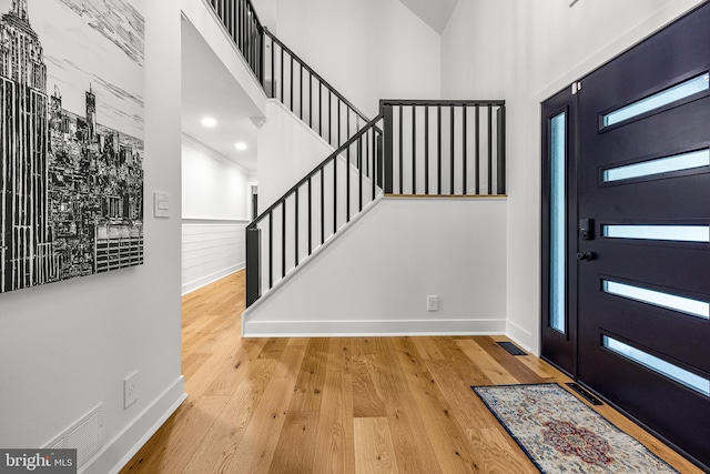 9 W Shore Ct, Landenberg, PA 19350 - entrance foyer featuring stairway, a towering ceiling, and hardwood / wood-style flooring