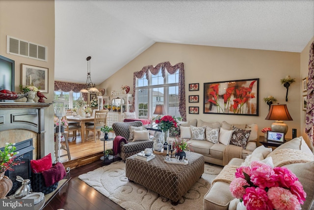 2404 Elfreths Aly, Bensalem, PA 19020 - living room with high vaulted ceiling, wood-type flooring, and a fireplace