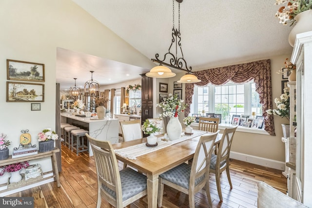 2404 Elfreths Aly, Bensalem, PA 19020 - dining space featuring a textured ceiling, wood finished floors, a chandelier, and lofted ceiling