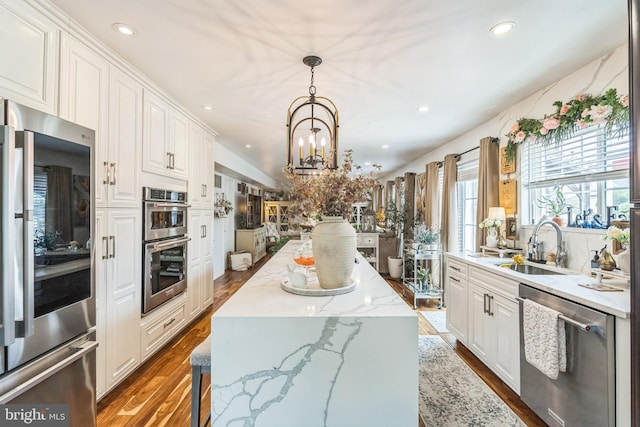 2404 Elfreths Aly, Bensalem, PA 19020 - kitchen featuring stainless steel appliances, recessed lighting, a kitchen island, white cabinets, and a chandelier