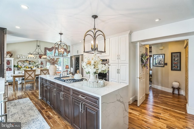 2404 Elfreths Aly, Bensalem, PA 19020 - kitchen featuring stainless steel appliances, wood finished floors, a chandelier, dark brown cabinetry, and recessed lighting