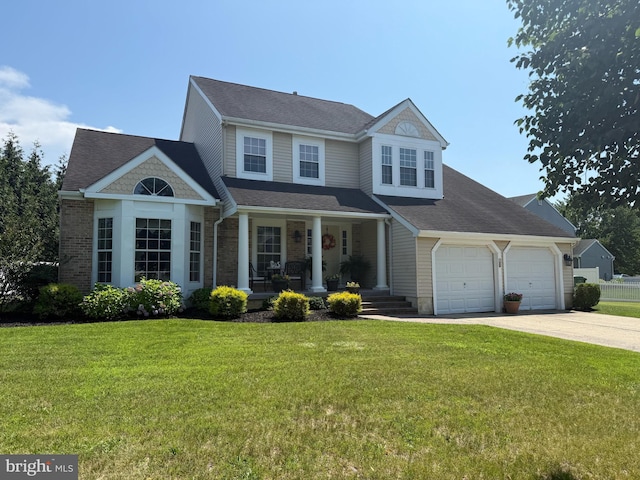 15 Quaker St, Marlton, NJ 08053 - view of front of property featuring covered porch, driveway, a garage, and a front yard