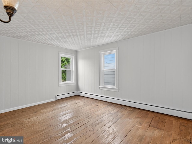 31 W Ferdinand St, Manheim, PA 17545 - spare room featuring plenty of natural light, hardwood / wood-style floors, an ornate ceiling, and wood walls