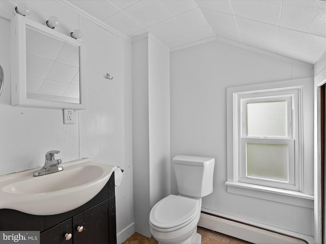 31 W Ferdinand St, Manheim, PA 17545 - bathroom featuring baseboard heating, vanity, and vaulted ceiling
