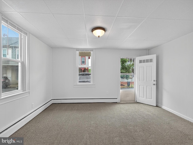 31 W Ferdinand St, Manheim, PA 17545 - carpeted empty room with a drop ceiling, plenty of natural light, and a baseboard heating unit