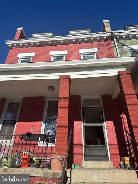 625 Upshur St NW, Washington, DC 20011 - view of front of house featuring brick siding and covered porch