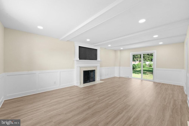 201 E Franklin Ave, Edgewater Park, NJ 08010 - unfurnished living room with beam ceiling, a fireplace, light wood-type flooring, a wainscoted wall, and recessed lighting