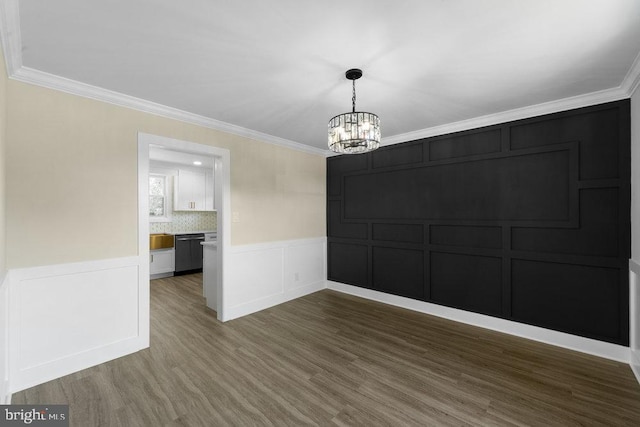 201 E Franklin Ave, Edgewater Park, NJ 08010 - unfurnished dining area featuring a decorative wall, a chandelier, dark wood-style floors, ornamental molding, and a wainscoted wall