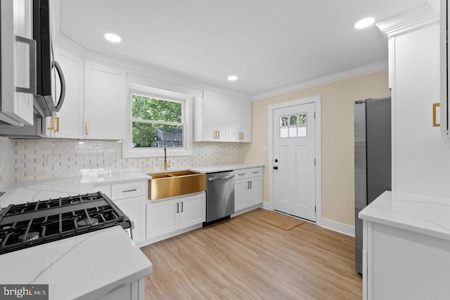 201 E Franklin Ave, Edgewater Park, NJ 08010 - kitchen with stainless steel appliances, decorative backsplash, light wood finished floors, white cabinets, and crown molding