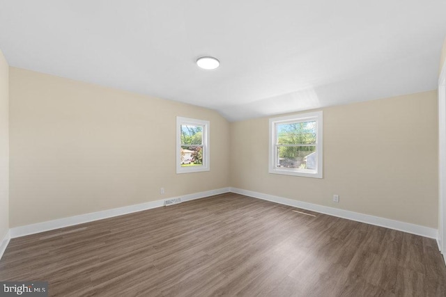201 E Franklin Ave, Edgewater Park, NJ 08010 - spare room with wood finished floors and vaulted ceiling