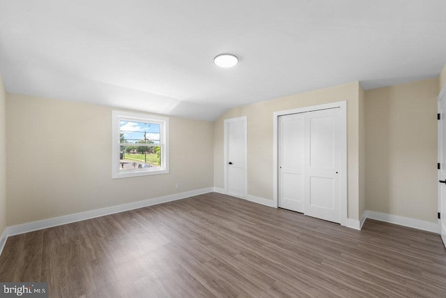 201 E Franklin Ave, Edgewater Park, NJ 08010 - unfurnished bedroom featuring wood finished floors, a closet, and lofted ceiling
