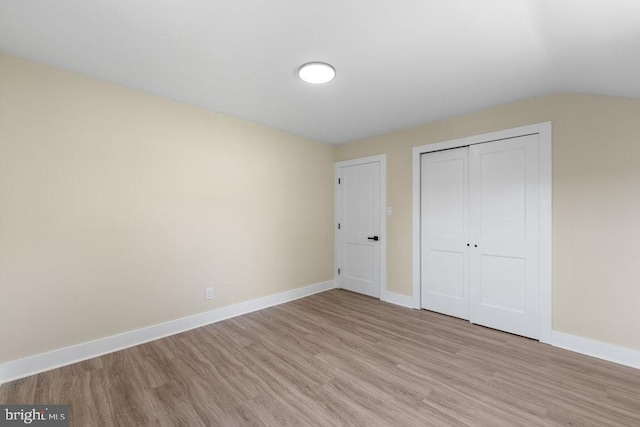 201 E Franklin Ave, Edgewater Park, NJ 08010 - unfurnished bedroom featuring light wood finished floors, a closet, and vaulted ceiling
