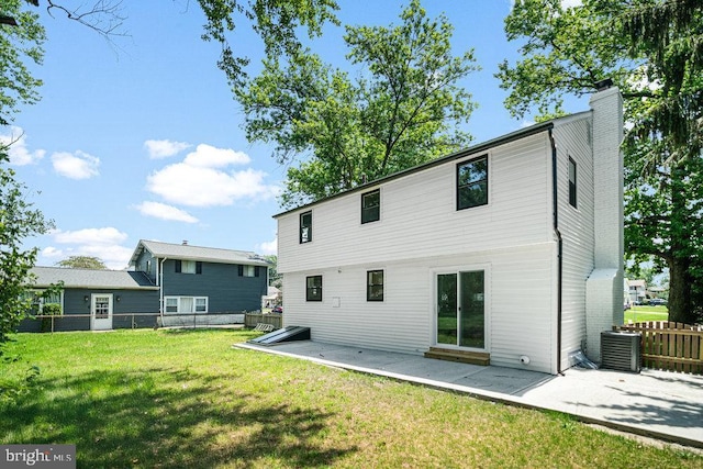 201 E Franklin Ave, Edgewater Park, NJ 08010 - back of property with a patio area and a chimney