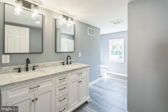 17 Sportsmans Rd, Carneys Point, NJ 08069 - full bathroom featuring double vanity and wood finished floors
