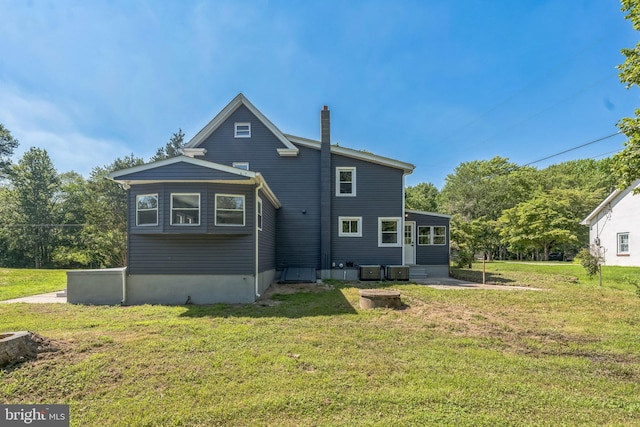 17 Sportsmans Rd, Carneys Point, NJ 08069 - rear view of house featuring a yard, a chimney, and entry steps