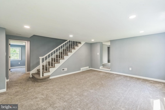 17 Sportsmans Rd, Carneys Point, NJ 08069 - unfurnished living room with stairway, carpet, and recessed lighting