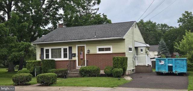 235 S Main St, Quakertown, PA 18951 - bungalow-style house featuring a shingled roof, a chimney, and brick siding