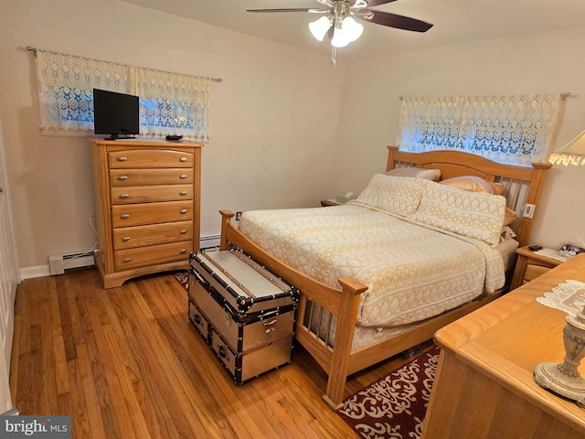 235 S Main St, Quakertown, PA 18951 - bedroom featuring a baseboard radiator, light wood-style flooring, and ceiling fan