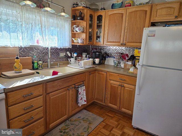 235 S Main St, Quakertown, PA 18951 - kitchen featuring freestanding refrigerator, light countertops, glass insert cabinets, and open shelves