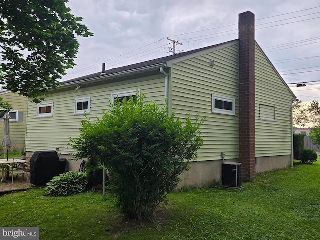 235 S Main St, Quakertown, PA 18951 - view of property exterior with a central AC unit and a yard