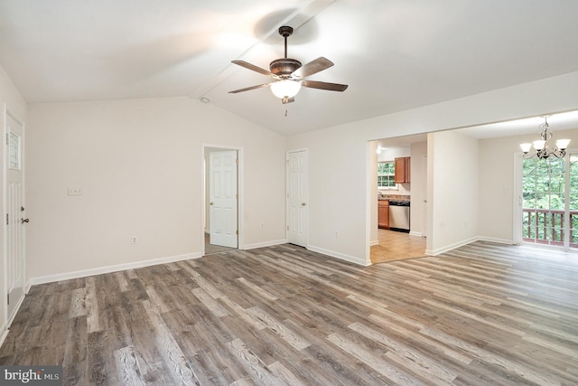 114 Dragoon Dr, Montross, VA 22520 - unfurnished living room featuring a ceiling fan, light wood-type flooring, a chandelier, and lofted ceiling