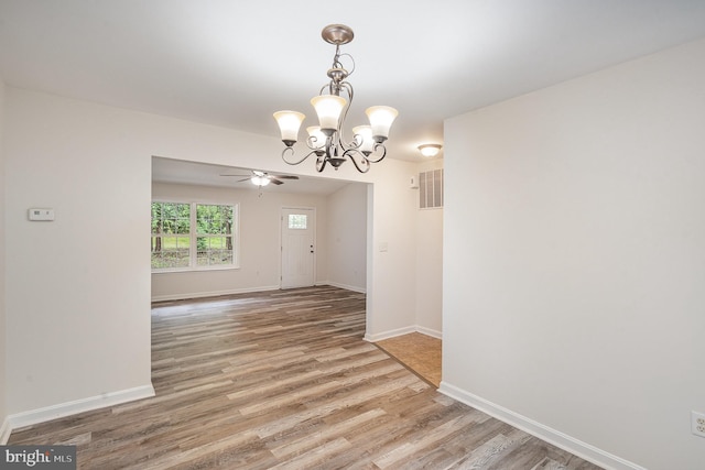 114 Dragoon Dr, Montross, VA 22520 - spare room featuring a chandelier, light wood finished floors, and a ceiling fan