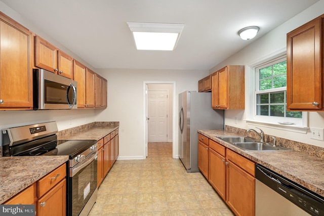 114 Dragoon Dr, Montross, VA 22520 - kitchen with stainless steel appliances and brown cabinetry