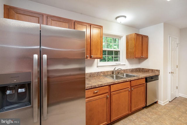 114 Dragoon Dr, Montross, VA 22520 - kitchen with stainless steel appliances, brown cabinets, and dark countertops