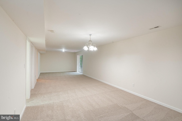 114 Dragoon Dr, Montross, VA 22520 - unfurnished room featuring light carpet and a chandelier