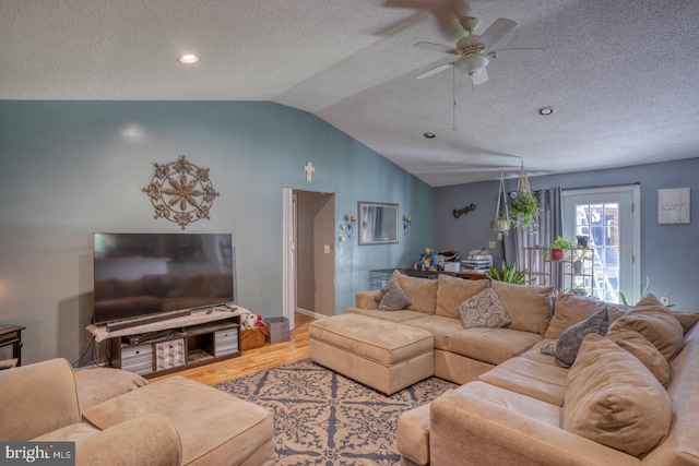 25036 Becks Ln, Georgetown, DE 19947 - living room featuring vaulted ceiling, wood finished floors, ceiling fan, and a textured ceiling