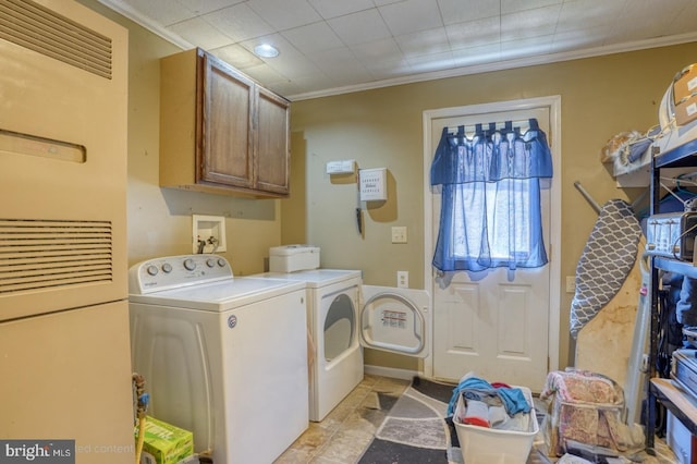 25036 Becks Ln, Georgetown, DE 19947 - laundry room featuring a heating unit, washer and dryer, cabinet space, and crown molding