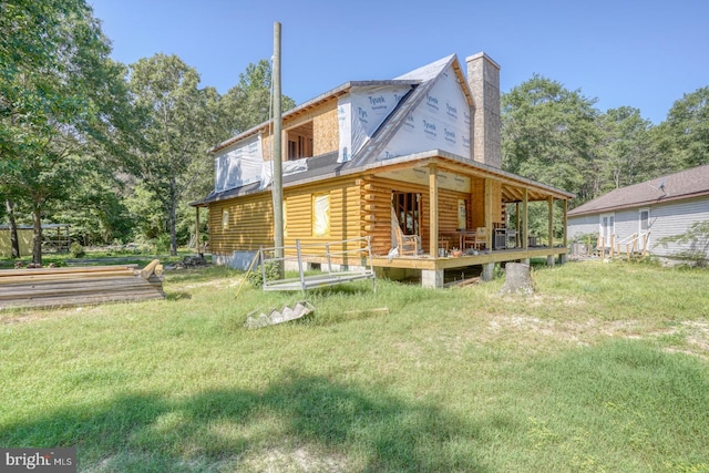 25036 Becks Ln, Georgetown, DE 19947 - rear view of property with log exterior, a chimney, and a lawn