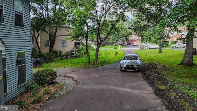 236 Jan Dr, Harleysville, PA 19438 - view of grassy yard featuring asphalt driveway