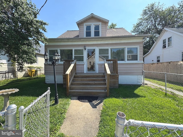 5417 Wasena Ave, Baltimore, MD 21225 - bungalow with roof with shingles and a fenced backyard