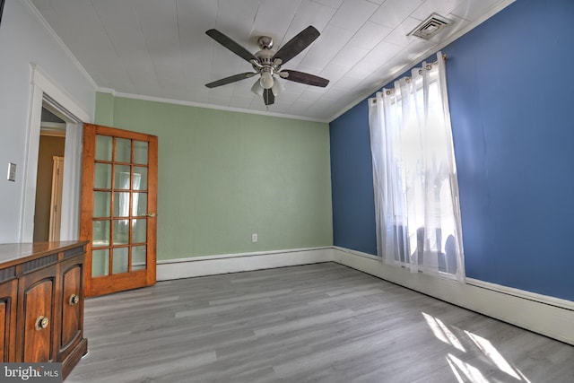 5417 Wasena Ave, Baltimore, MD 21225 - spare room with crown molding, light wood-type flooring, and ceiling fan