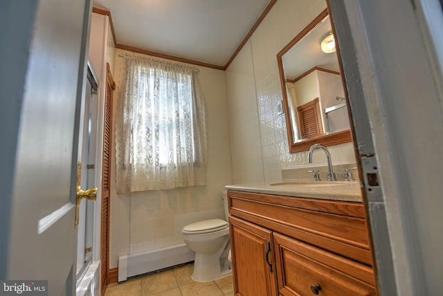 5417 Wasena Ave, Baltimore, MD 21225 - bathroom with vanity, ornamental molding, tile walls, tile patterned flooring, and a baseboard radiator