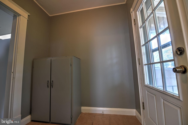 5417 Wasena Ave, Baltimore, MD 21225 - doorway with light tile patterned floors and crown molding