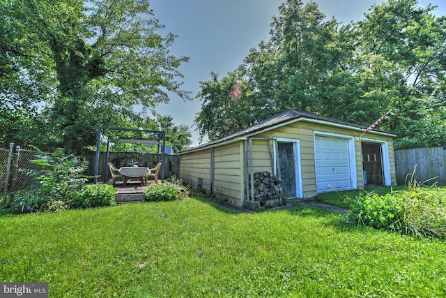 5417 Wasena Ave, Baltimore, MD 21225 - view of yard featuring an outdoor structure, a pergola, and a detached garage
