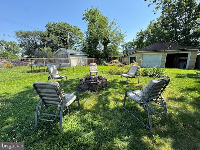 5417 Wasena Ave, Baltimore, MD 21225 - view of yard featuring an outbuilding, a detached garage, and a fire pit