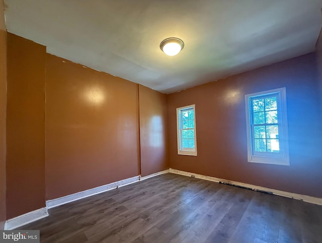 2424 Greenmount Ave, Baltimore, MD 21218 - spare room with plenty of natural light and dark wood-type flooring