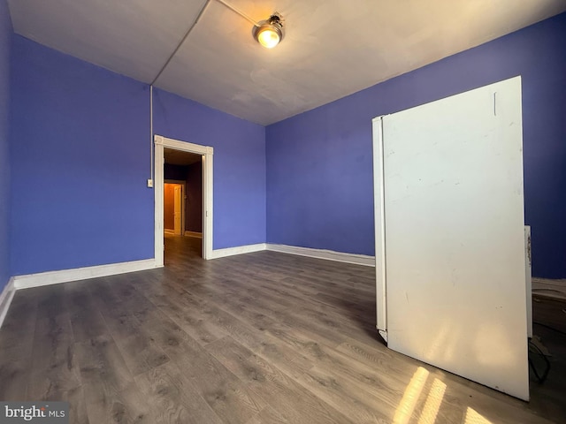 2424 Greenmount Ave, Baltimore, MD 21218 - unfurnished room featuring baseboards and wood finished floors