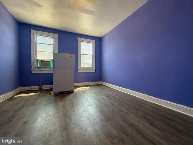 2424 Greenmount Ave, Baltimore, MD 21218 - empty room featuring wood finished floors and cooling unit
